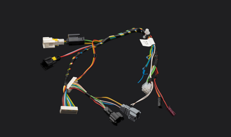 Production of wire harnesses, plastic and metal components